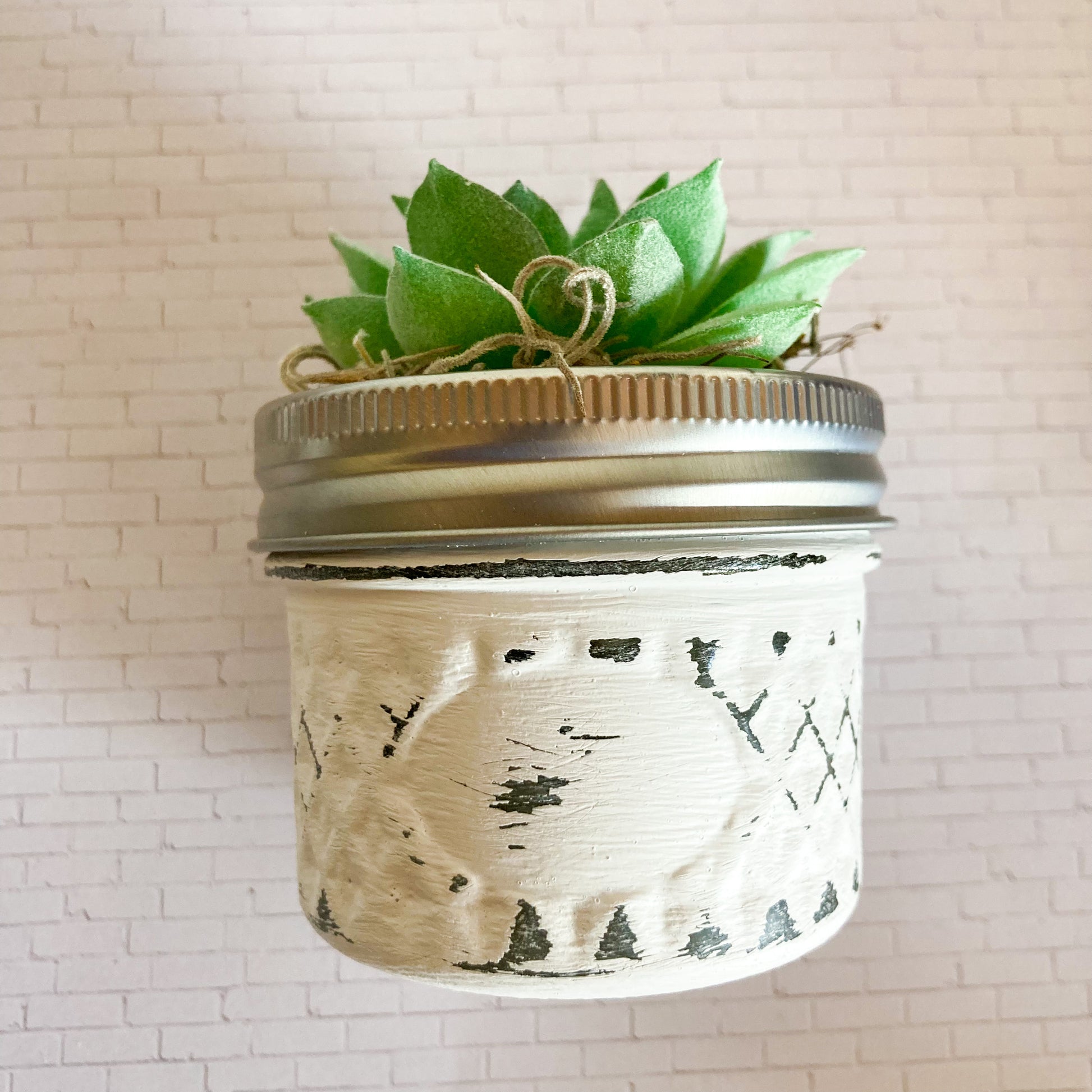 Mini faux green succulent plant in small distressed white glass jar approximatly 3-4" tall and 2.75" in diameter